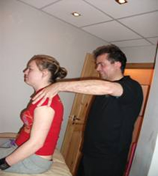 Lady getting Sports massage for whiplash therapy for treatment in whiplash or sports injuries